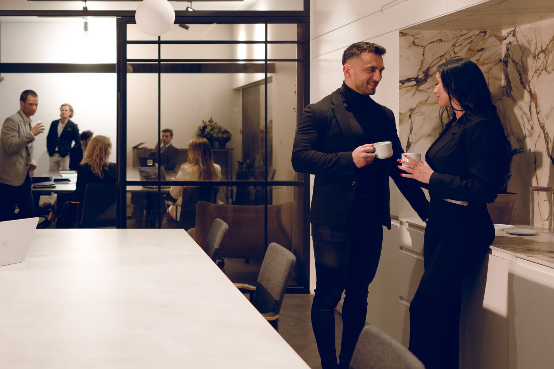 Team meeting in the office – colleagues discussing at a conference table.